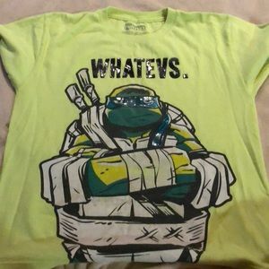 Yellow ninja turtle shirt.